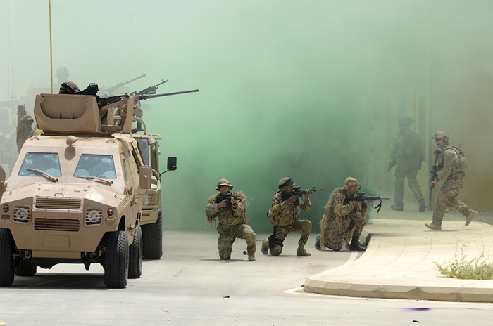 Coalition service members with Combined Joint Task Force Spartan provide security for their teams during a capabilities demonstration for King Abdullah II of Jordan May 16, 2012, as part of exercise Eager Lion 2012 at the King Abdullah II Special Operations Training Center in Amman, Jordan. Eager Lion is a U.S. Central Command-directed, irregular warfare-themed exercise focusing on missions the United States and its coalition partners might perform in support of global contingency operations. (DoD photo by Spc. Samantha Parks, U.S. Army photo/Released)